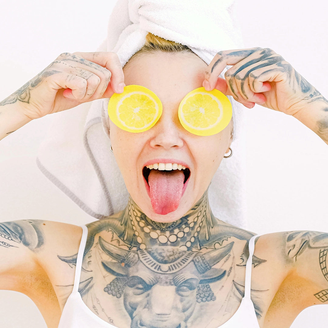 Girl with lemons over eyes