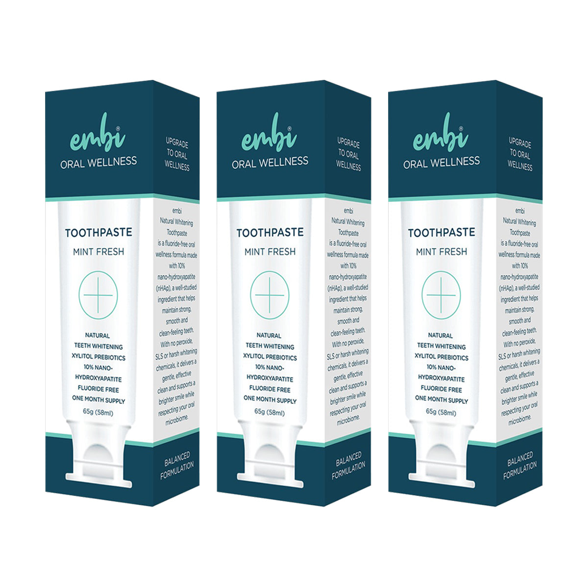 Three boxes of embi Oral Wellness toothpaste on a white background